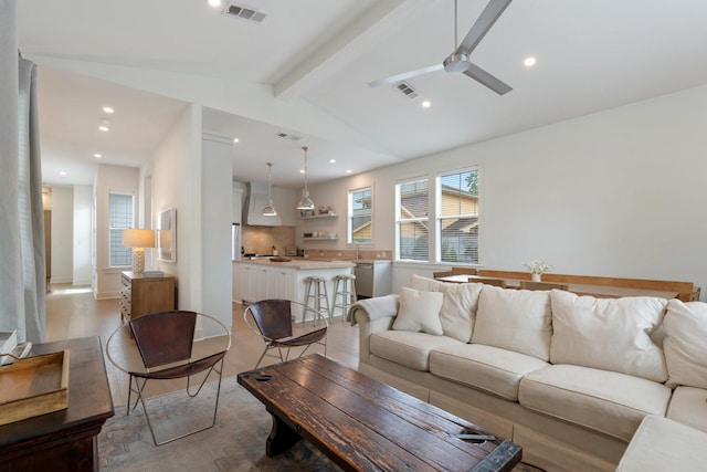 living area with vaulted ceiling with beams, ceiling fan, recessed lighting, and visible vents