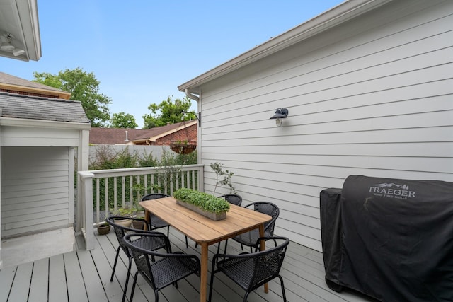 wooden terrace featuring grilling area