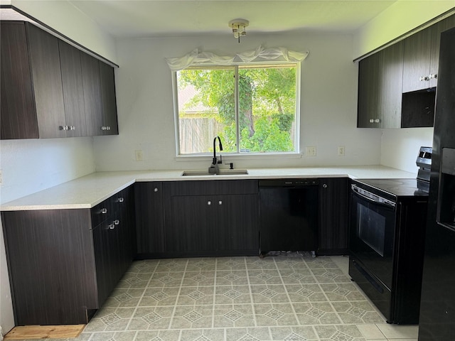 710 Fawnwood Dr, Missouri City, TX 77489 - kitchen featuring light countertops, a sink, and black appliances