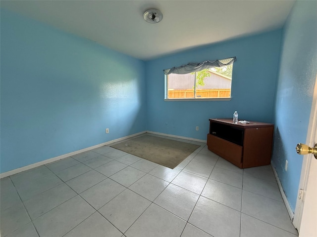710 Fawnwood Dr, Missouri City, TX 77489 - empty room with baseboards and light tile patterned floors