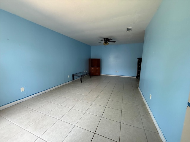 710 Fawnwood Dr, Missouri City, TX 77489 - empty room featuring a ceiling fan, baseboards, visible vents, and light tile patterned floors