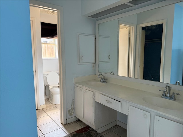 710 Fawnwood Dr, Missouri City, TX 77489 - bathroom with a sink, tile patterned floors, and double vanity