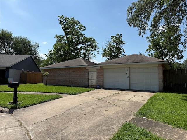 710 Fawnwood Dr, Missouri City, TX 77489 - ranch-style house featuring brick siding, a front lawn, and fence