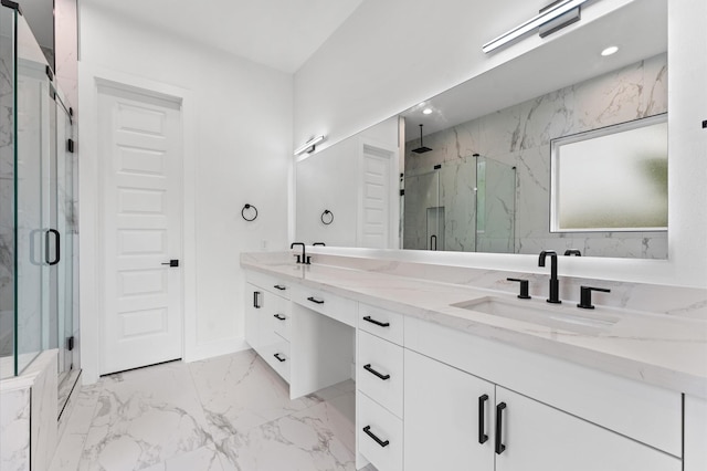 full bath featuring double vanity, a marble finish shower, a sink, and marble finish floor