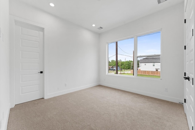 unfurnished bedroom featuring baseboards, carpet flooring, recessed lighting, and visible vents