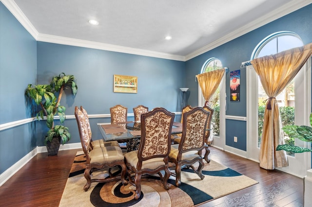 dining area with crown molding, plenty of natural light, and hardwood / wood-style floors