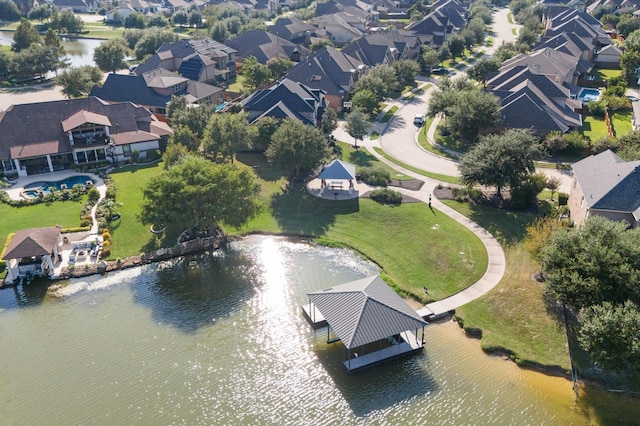 drone / aerial view with a residential view and a water view