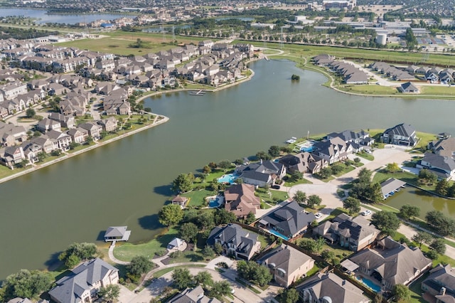 birds eye view of property with a residential view and a water view