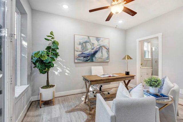 home office with a ceiling fan, baseboards, recessed lighting, and light wood-style flooring