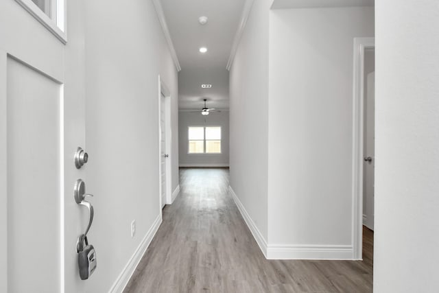 10310 Woodhill Spa Ln, Cleveland, TX 77327 - hallway with wood finished floors, baseboards, crown molding, and recessed lighting