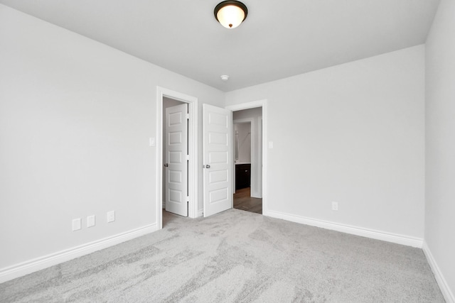 10310 Woodhill Spa Ln, Cleveland, TX 77327 - unfurnished bedroom with carpet flooring and baseboards