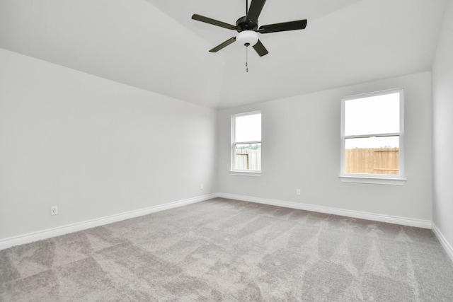10310 Woodhill Spa Ln, Cleveland, TX 77327 - carpeted empty room featuring vaulted ceiling, baseboards, and a ceiling fan