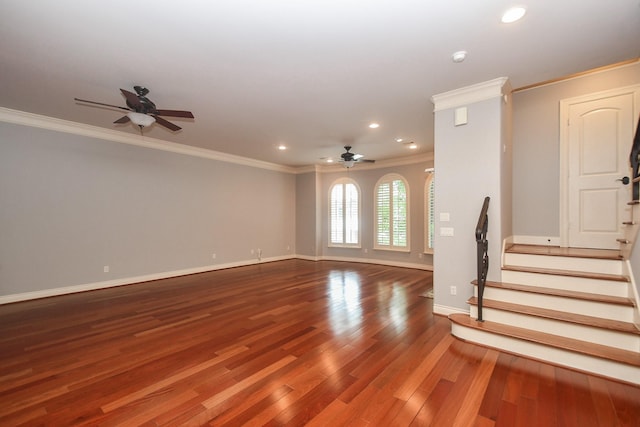 unfurnished living room featuring crown molding, a ceiling fan, stairs, and wood finished floors