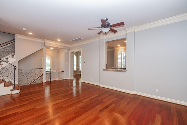 unfurnished living room featuring crown molding, a ceiling fan, stairs, and wood finished floors
