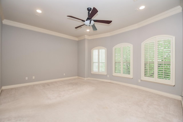 carpeted spare room with baseboards, crown molding, ceiling fan, and recessed lighting