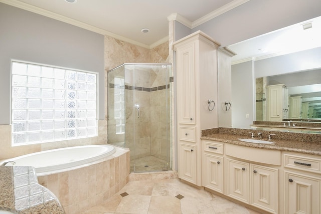 full bathroom featuring crown molding, a shower stall, a garden tub, and vanity