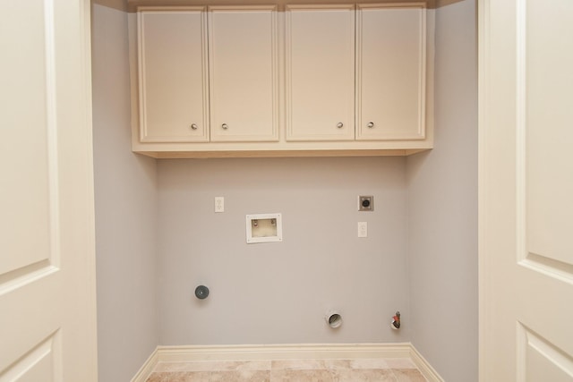 clothes washing area featuring baseboards, hookup for an electric dryer, hookup for a gas dryer, and washer hookup