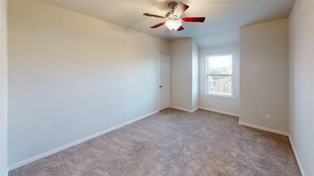 24129 Auburn Falls Ln, Porter, TX 77365 - carpeted spare room with baseboards and a ceiling fan
