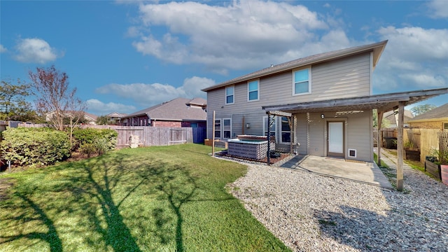 back of property featuring a fenced backyard, a patio, and a yard