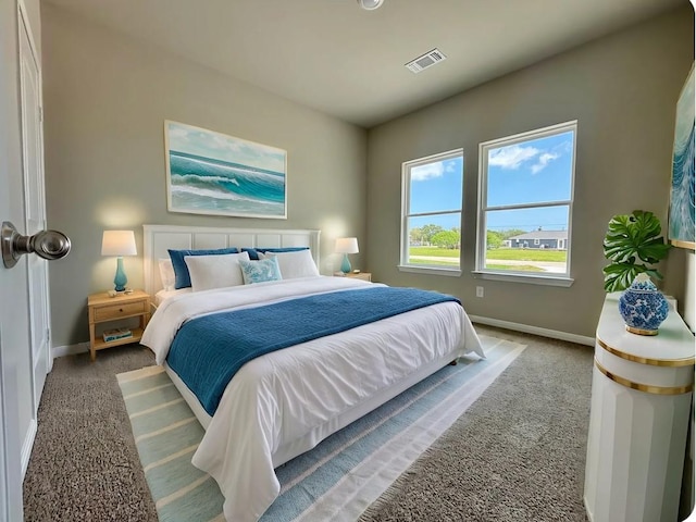 bedroom with baseboards, carpet floors, and visible vents