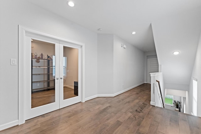 interior space with recessed lighting, french doors, and wood finished floors