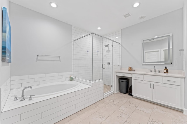 full bath with vanity, recessed lighting, a shower stall, visible vents, and a garden tub