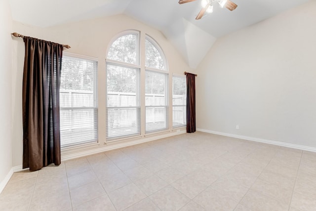 unfurnished room with light tile patterned floors, baseboards, a ceiling fan, and lofted ceiling