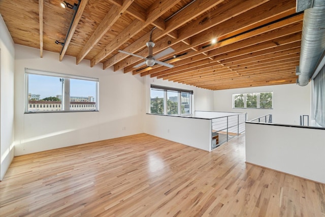 empty room with a ceiling fan and wood finished floors
