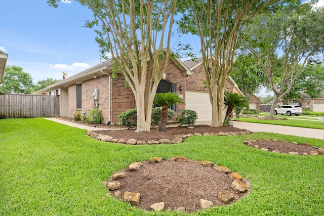 2220 W Marsala Dr, Pearland, TX 77581 - view of front of property with driveway, a garage, brick siding, fence, and a front lawn