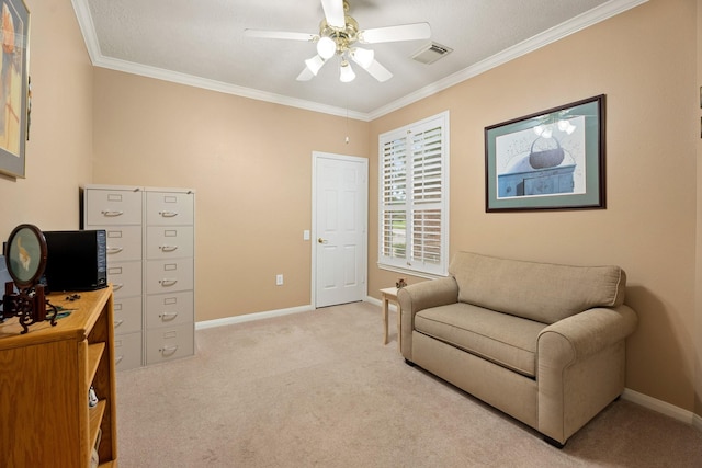 living area featuring visible vents, ornamental molding, ceiling fan, and light colored carpet