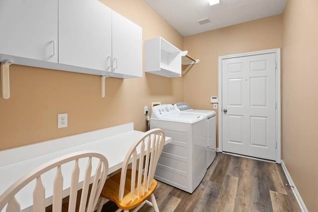 2220 W Marsala Dr, Pearland, TX 77581 - clothes washing area with visible vents, dark wood-style flooring, baseboards, cabinet space, and independent washer and dryer