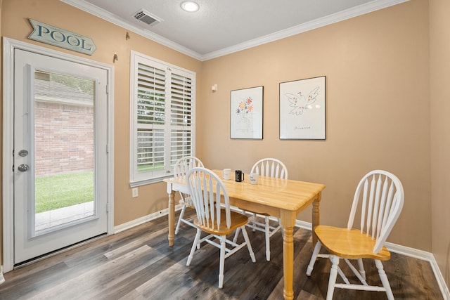 2220 W Marsala Dr, Pearland, TX 77581 - dining space with crown molding, recessed lighting, baseboards, dark wood-type flooring, and visible vents