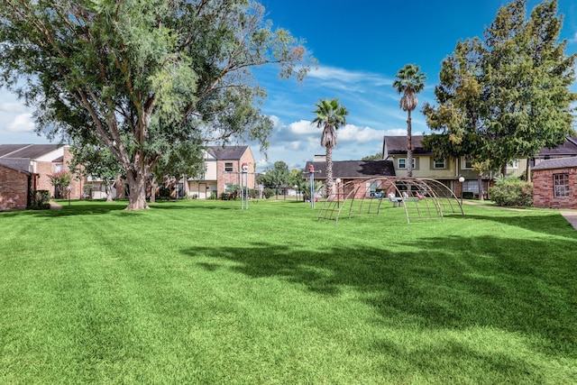 view of yard with playground community and a residential view