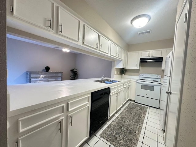 kitchen with visible vents, white appliances, light countertops, under cabinet range hood, and a sink