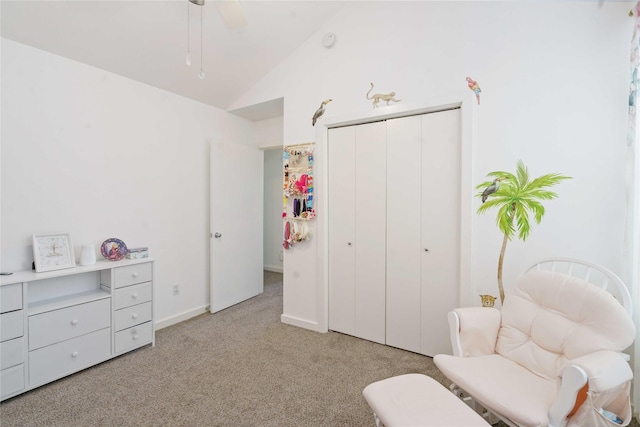 sitting room featuring light colored carpet, lofted ceiling, and ceiling fan