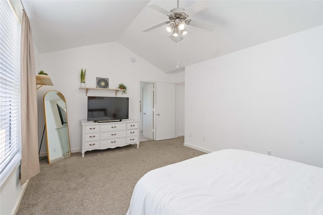bedroom with light colored carpet, lofted ceiling, ceiling fan, and baseboards