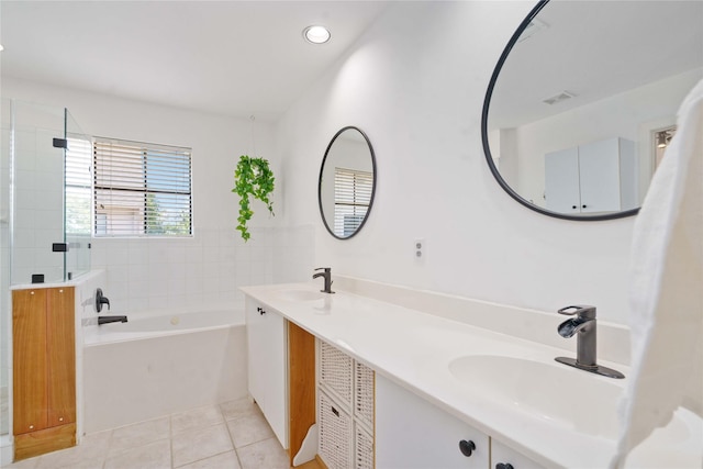 full bath featuring tile patterned flooring, a bath, tiled shower, double vanity, and recessed lighting