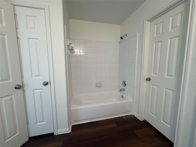 bathroom featuring shower / bathtub combination and wood finished floors