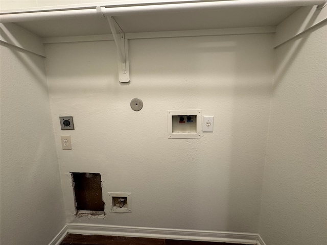 laundry area featuring dark wood-style flooring, washer hookup, laundry area, hookup for a gas dryer, and hookup for an electric dryer