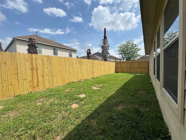 view of yard featuring a fenced backyard