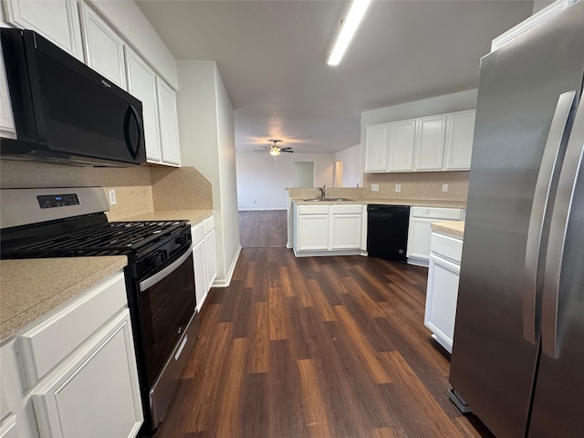 kitchen with light countertops, dark wood finished floors, a sink, and black appliances