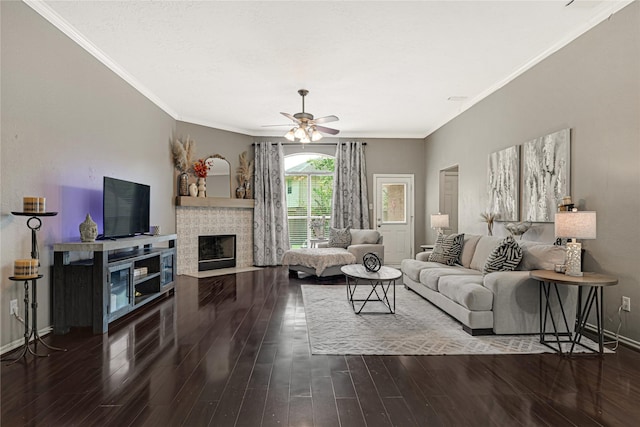 living area with crown molding, a ceiling fan, and wood finished floors