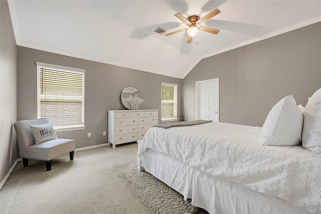 carpeted bedroom with crown molding, baseboards, vaulted ceiling, and visible vents