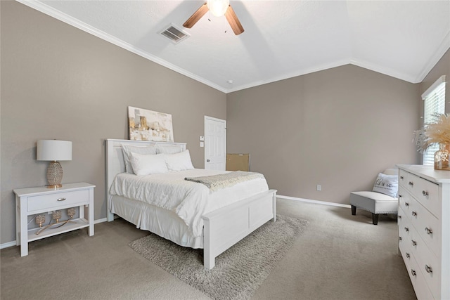 carpeted bedroom with visible vents, baseboards, crown molding, and vaulted ceiling