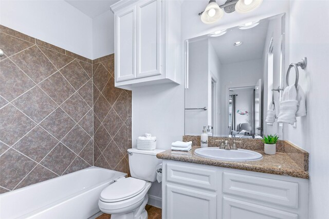full bathroom featuring vanity, toilet, and connected bathroom