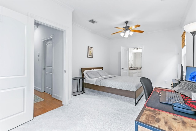 bedroom featuring crown molding, carpet flooring, a ceiling fan, baseboards, and visible vents