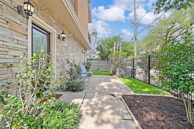 view of yard featuring a patio and a fenced backyard
