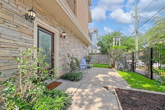 view of patio / terrace featuring fence