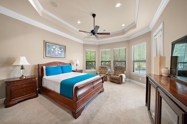 bedroom with a tray ceiling, carpet, crown molding, baseboards, and recessed lighting