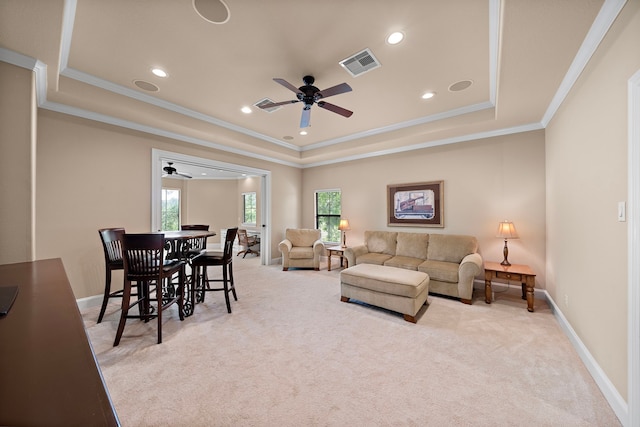 living area featuring ceiling fan, carpet flooring, a tray ceiling, recessed lighting, and crown molding